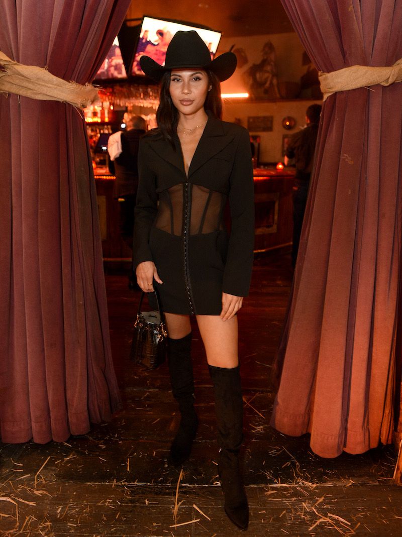 Guest in a black felt cattleman crease Tom Ford Cowboy Hat at the Ombré Leather Parfum launch party in West Hollywood, California.