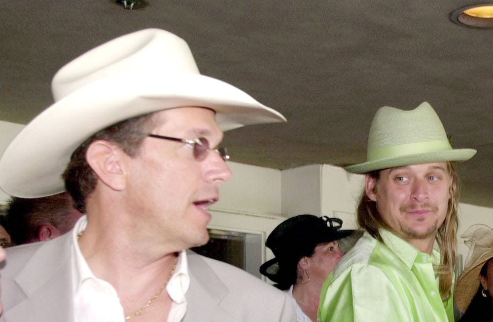 George Strait in a straw cowboy hat with Kid Rock in a custom, pale lime green Panama hat
