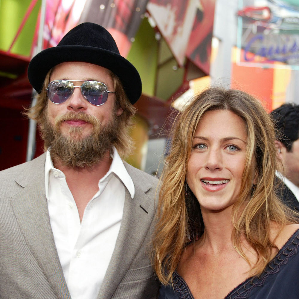 Brad Pitt and Jennifer Aniston in a black felt trilby at the premiere of “The Bourne Identity” at Universal CityWalk in Los Angeles, CA