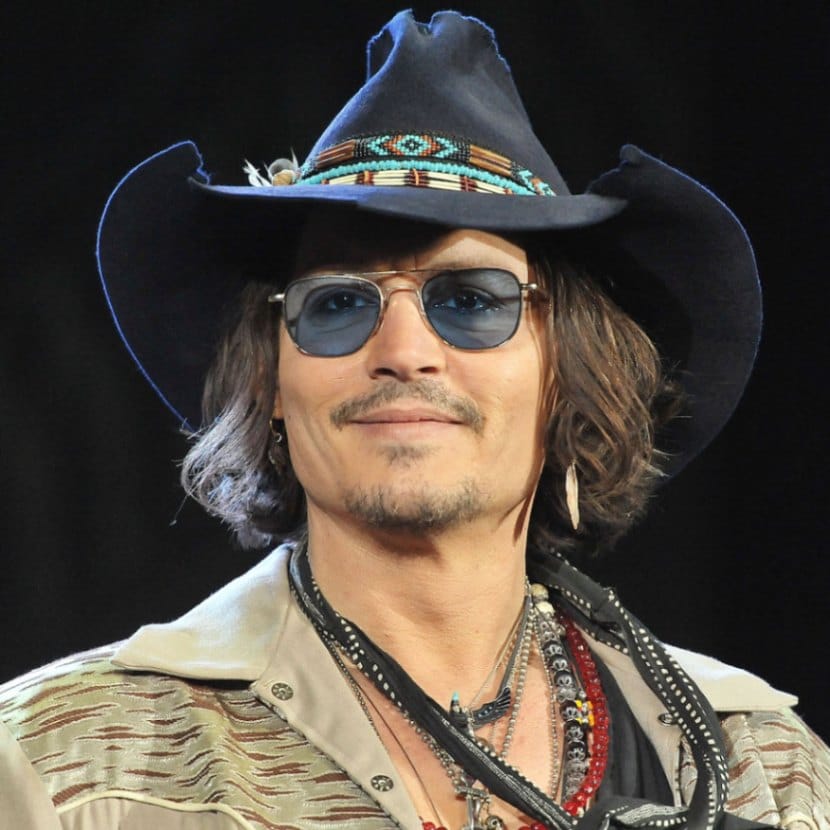 Johnny Depp wears a tattered cowboy hat to the Dark Shadows premiere in Japan