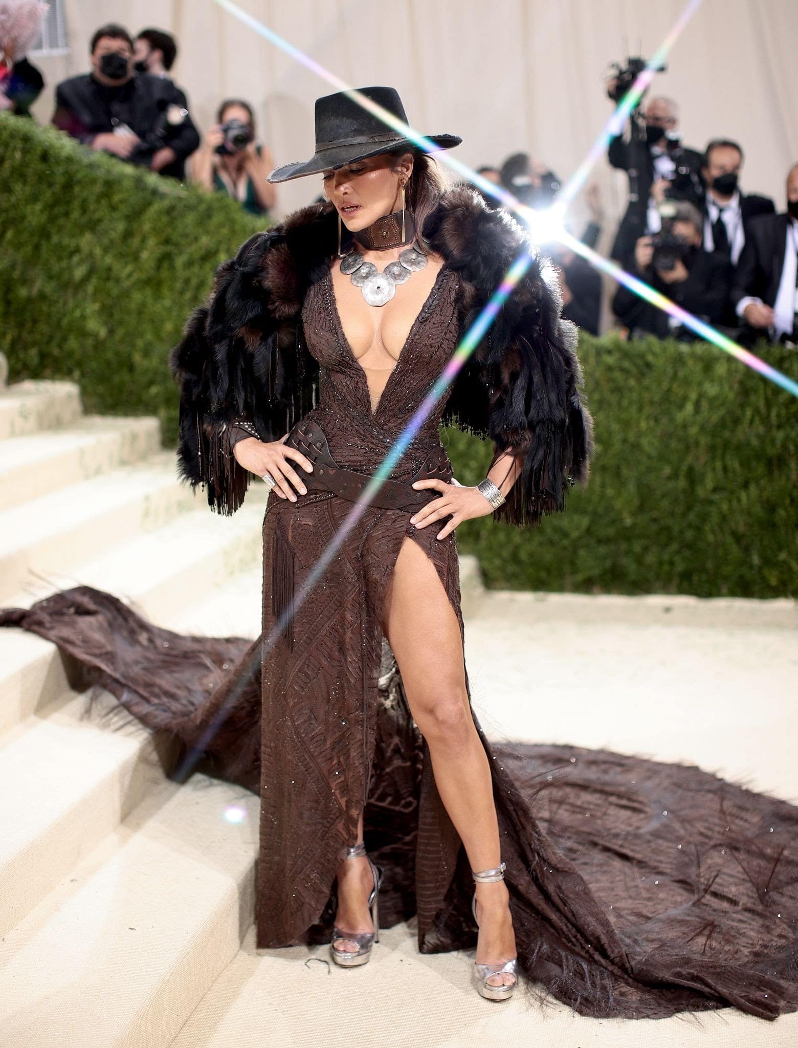 Jennifer Lopez entered the Met Gala in a custom brown leather women’s cowboy hat and gown (Photo by Dimitrios Kambouris/Getty Images for The Met Museum/Vogue)