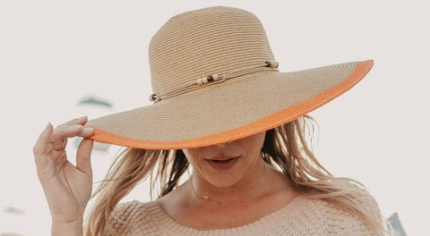 Woman wearing a women’s floppy sun hat