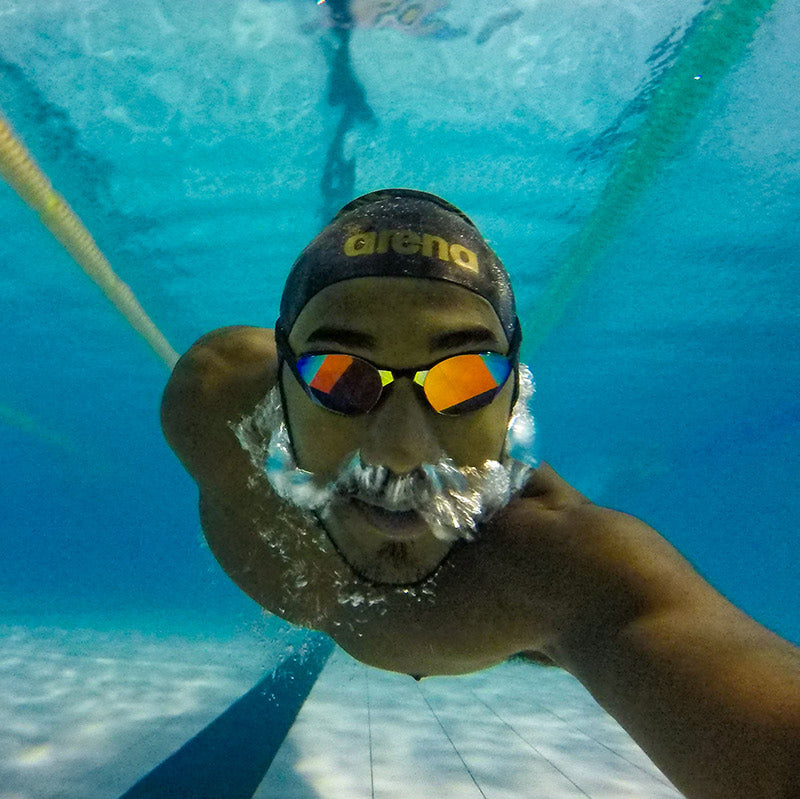 Swimmer wearing THEMAGIC5 Goggles