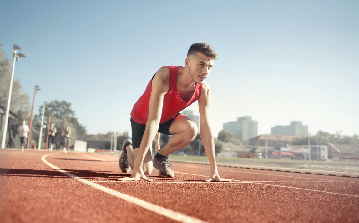 An image of a track and field athlete in a sprint start position