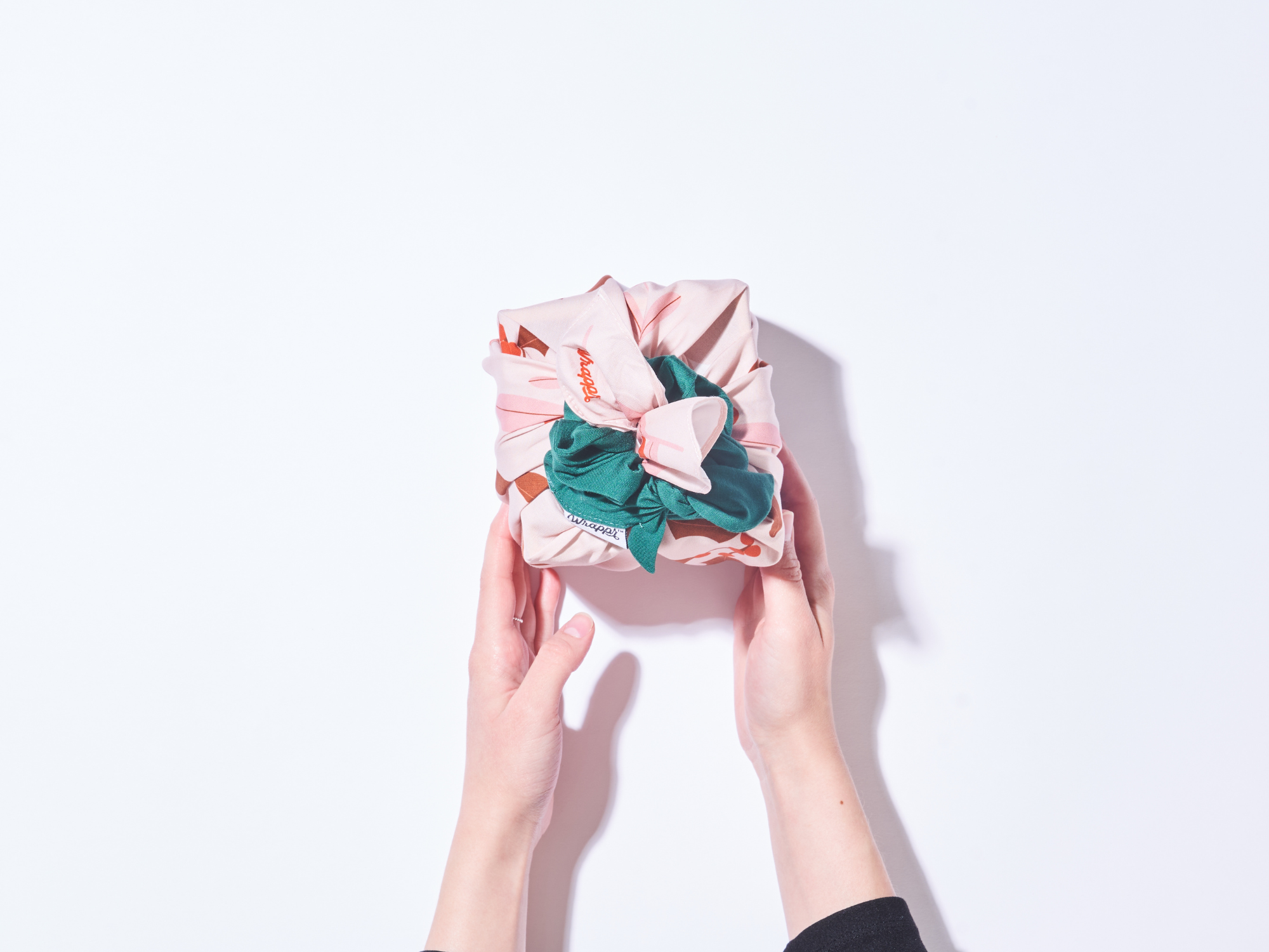 a gift wrapped with in furoshiki and a scrunchie 