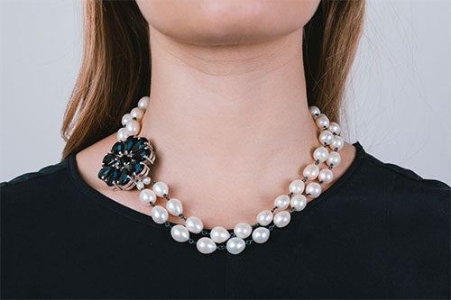 Feminine and timless pearl and onxy flower necklace by Crown Jewels. Revamp your little black dress or silk blouse. 