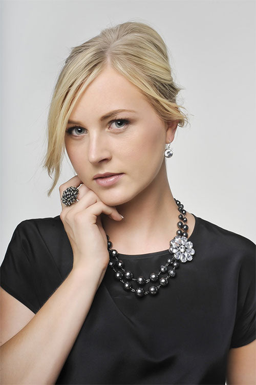 A perennial hematite and zirconia flower necklace by Crown Jewels.  Perfect for winter dressing