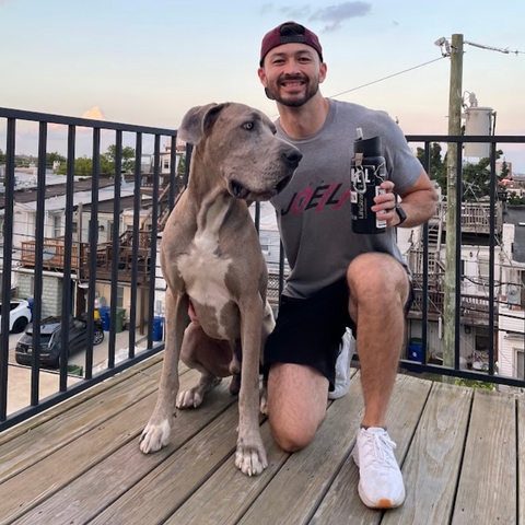 Man with great dane and LifeStraw Go