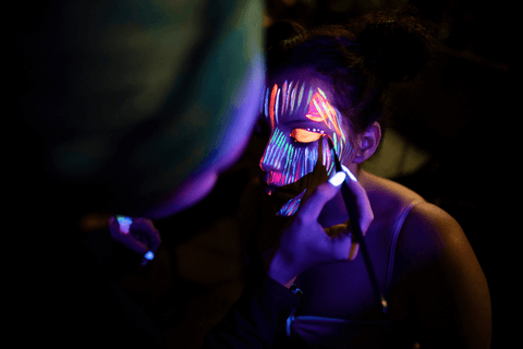 Glow-in-the-dark face and body paint