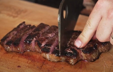 cutting up new york steak