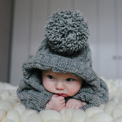 baby in knitted clothes