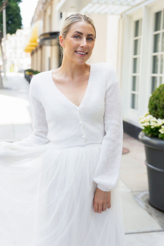 Light wedding jacket with knots in ivory suiting your bridal skirt
