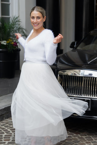 Bride with knit jacket in front of Rollce Royce