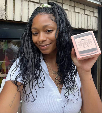 Staffer Divine holds her fave Boy Smells candle Cameo