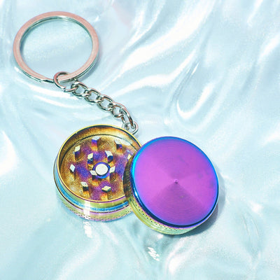 https://cdn.shopify.com/s/files/1/2636/1058/files/mini-metal-grinder-keychain-rainbow-aesthetic-smoke-chrome-cute-gift-guide-stoner-667.jpg?v=1698054950&width=400