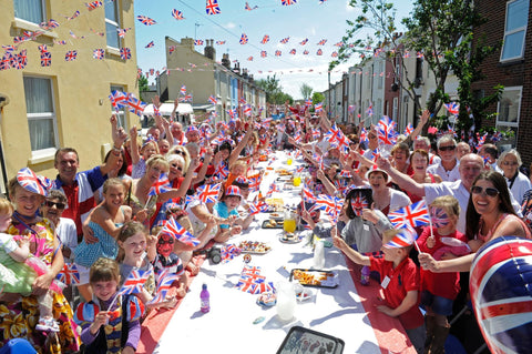 Busy street party with lots of people celebrating Britain.