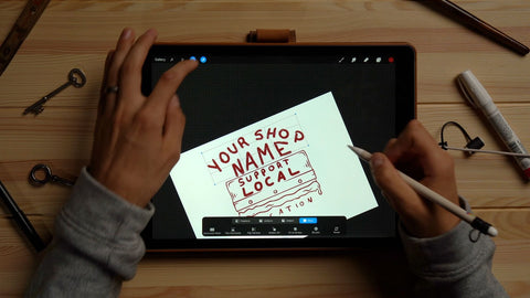 person drawing a squeegee design on an ipad