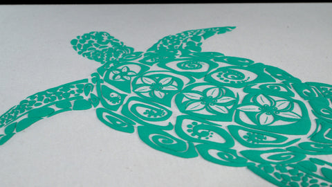 Una imagen de una tortuga impresa con tinta de hojaldre turquesa