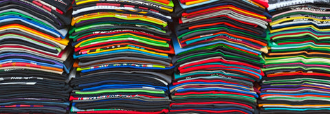 a stack of colorful shirts