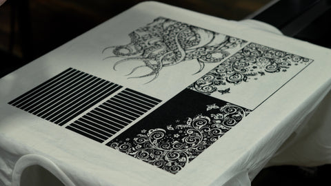 a white t-shirt with detailed tentacles and paisleys on it printed with puff ink