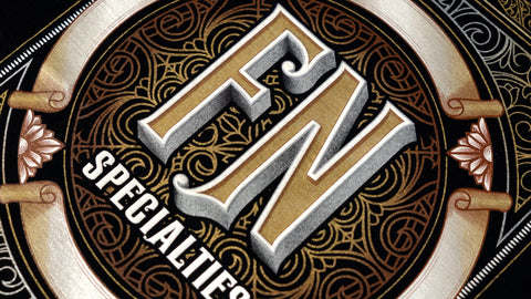 A design with metallic inks reading "FN Specialties"