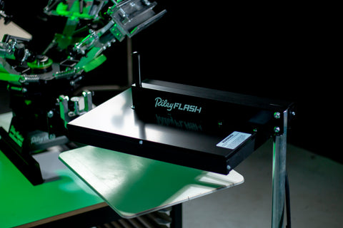 A flash unit sits above a press