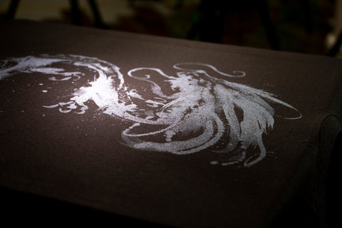a dragon design in silver ink