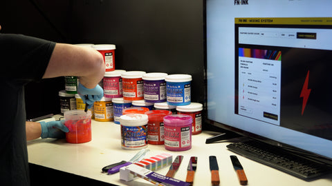 person mixing ink with the fn-ink mixing software on their computer