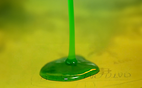 a green chemical blob on a screen