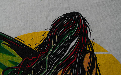 a close-up shot of the surfer girl's head with red and green ink