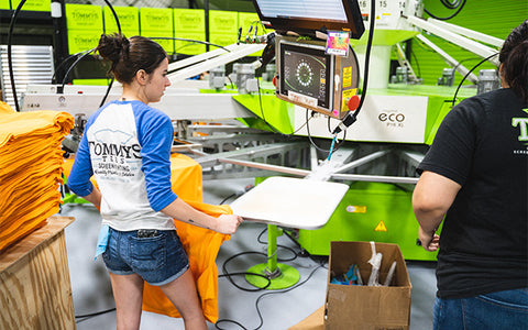 a printer stands at an automatic press