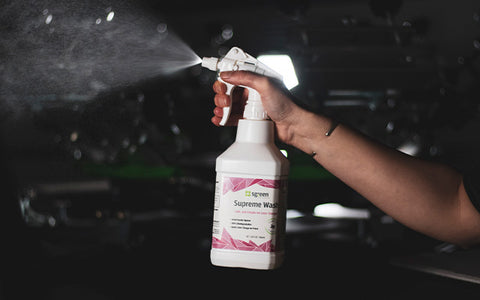 sgreen supreme wash sprays in a shop space