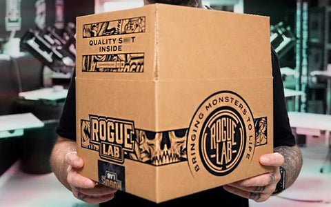 a man holds a box that has been custom printed with black ink