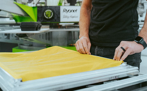 Screen Printer installing mesh on an Eco Frame