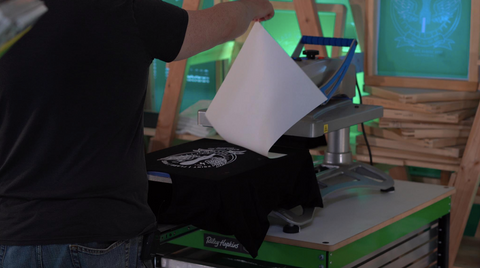 colin pulling the transfer paper off the print