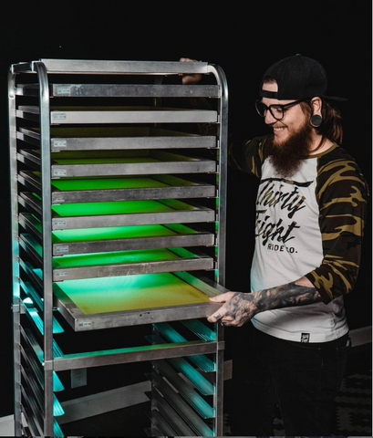 Screens being loaded into a drying rack