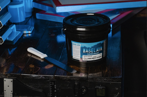 baselayr plastisol emulsion on a table next to a spatula