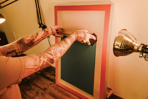 person coating a screen