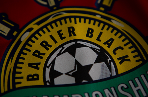 Text reading "Barrier Black" wrapped around a soccer ball