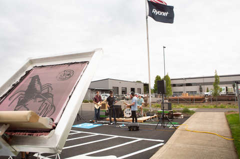 a band playing in a parking lot