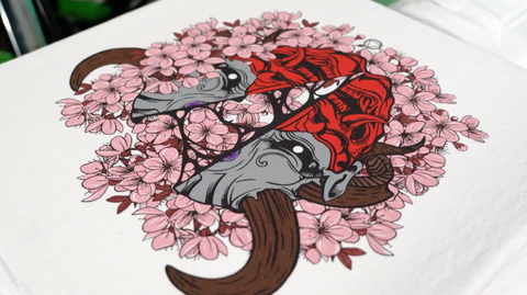 Japanese Samurai Oni surrounded by cherry blossoms printed on a white shirt