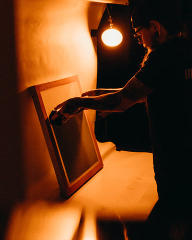 person coating a screen