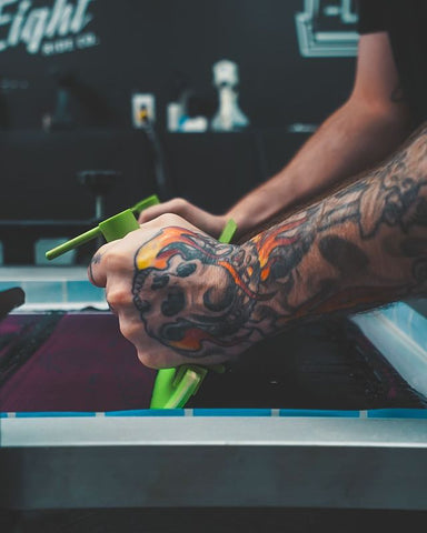 person pulling an ez grip across a screen