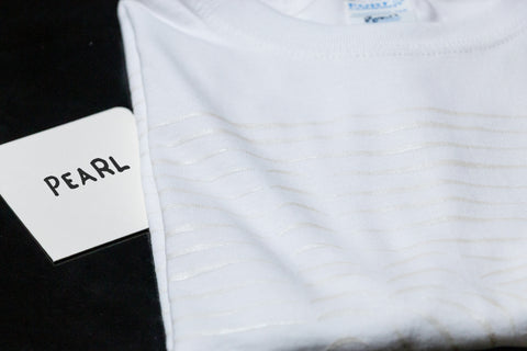 A white shirt with pearl ink printed on it