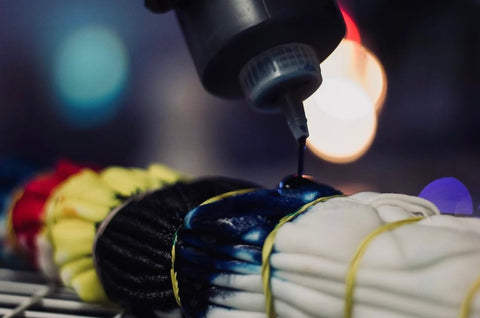 A shirt with rubber bands on it getting dyed