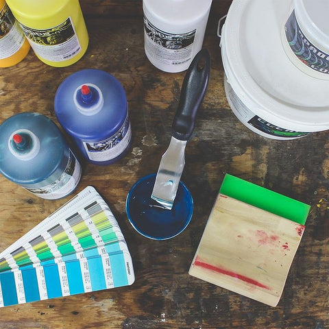 A pantone mixing system with supplies and a squeegee