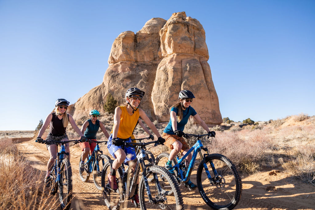 Women riding bikes in the desert