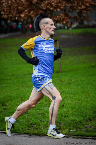 Man with mohican running wearing Sockmine socks