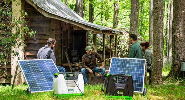 Solar Generators Charging with Solar Panels Outside the Cabin