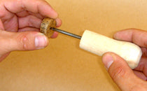 making a hole in a paper plug
